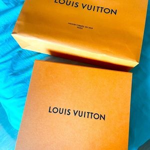 A large LV carry bag and box. Original. No wear tear.